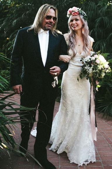 Vince Neil walking his daughter Elizabeth Ashley Wharton down the aisle.